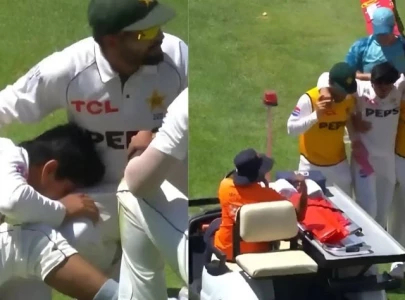 WATCH: Saim Ayub stretchered off after twisting ankle during SA Test